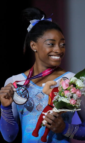 Biles sets record by picking up 13th world championship gold
